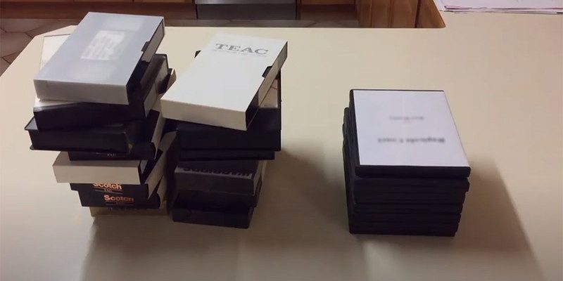 A pile of VHS tapes to be converted to DVD